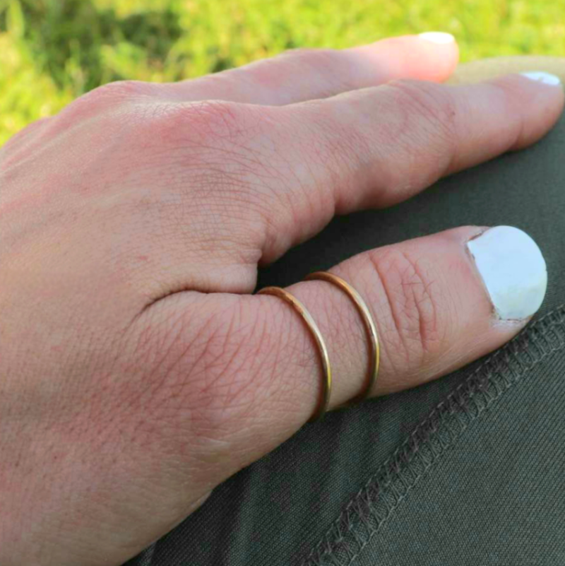 Gold Space Between Ring worn on woman's thumb