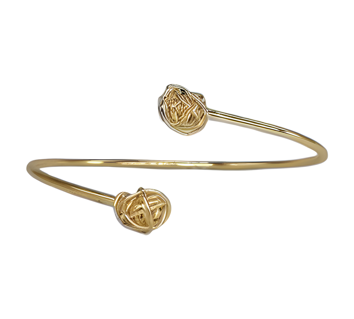 Gold adjustable bracelet with gold wire knots at each end in front of a white background.