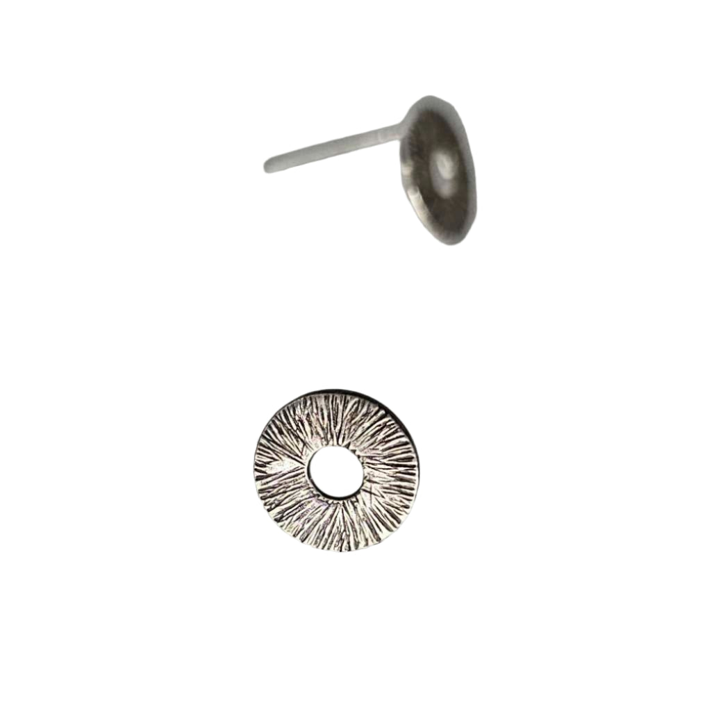 Stud silver Circle earrings textured with lines around empty space in the middle.