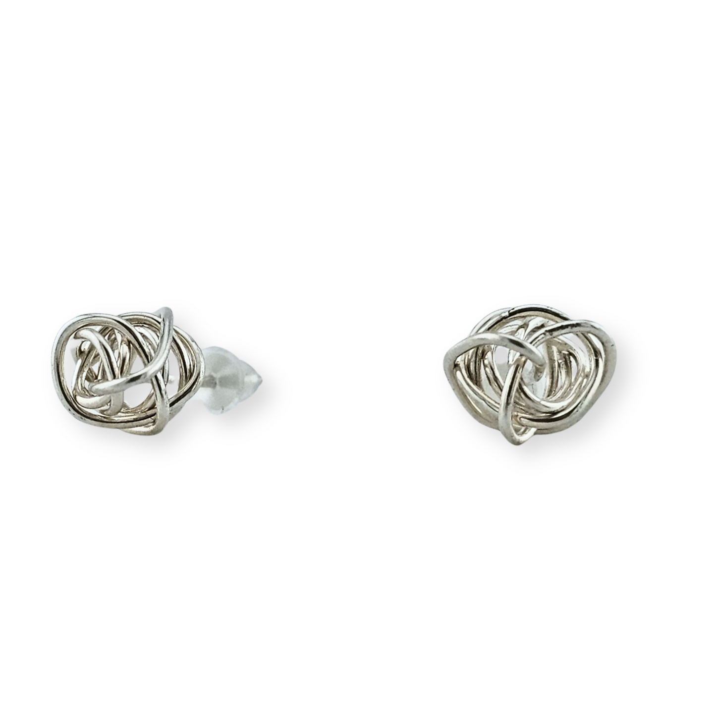 Close up of Silver Winding Knot Stud Earrings by Jaclyn Nicole 