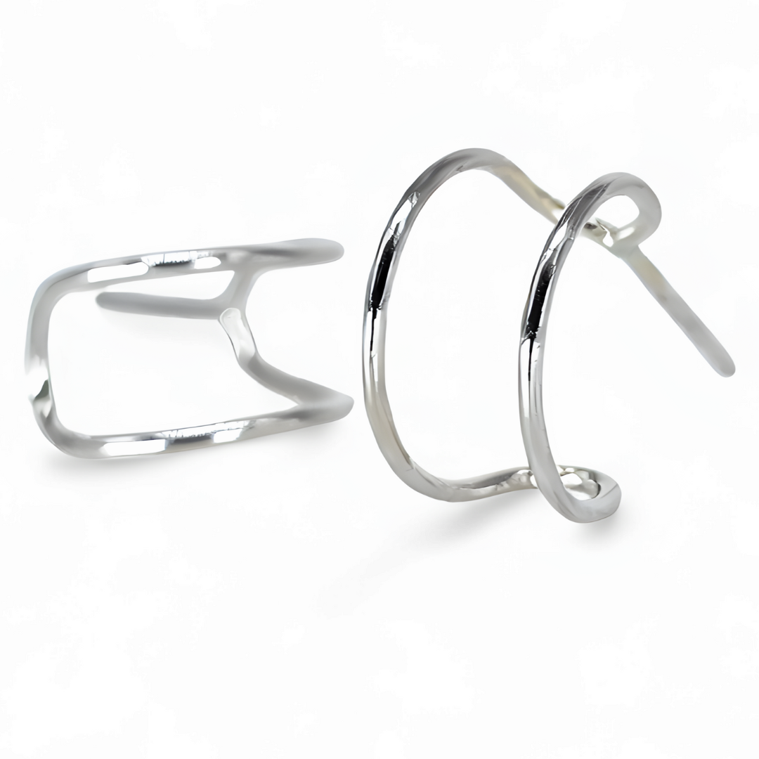 Close up of handmade Silver cuff hoop earrings