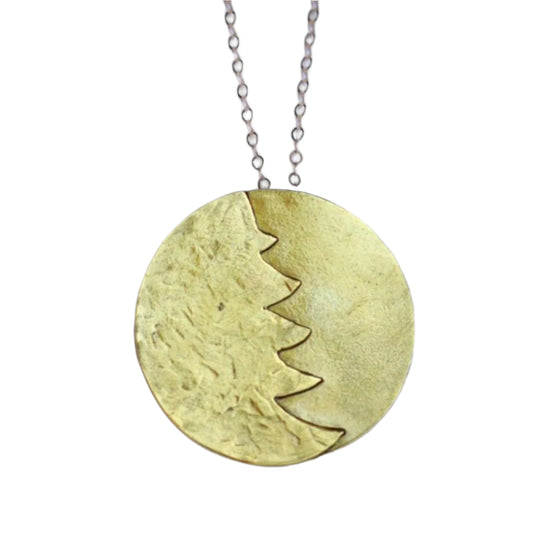 A gold christmas necklace pendant necklace on a white background.