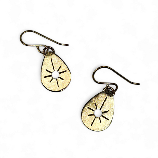 Gold Drop earrings in teardrop shape with Starburst cut out of the center.