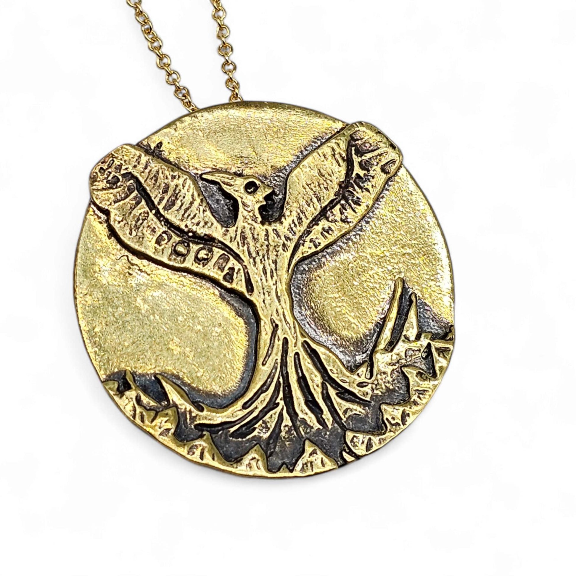 Gold handcrafted Phoenix necklace as a symbol of resilience