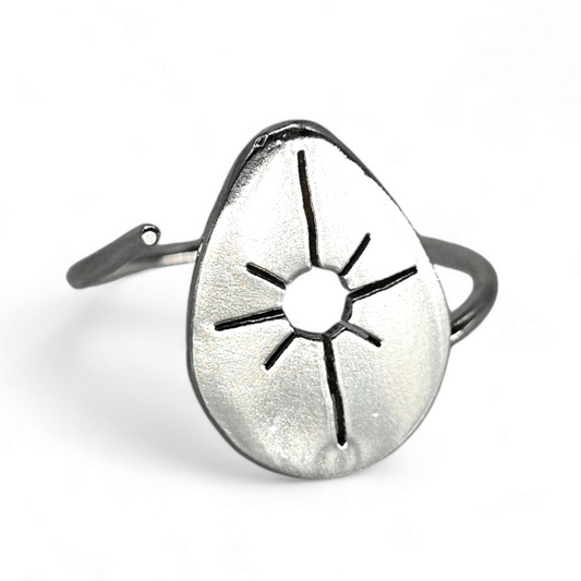 Adjustable Drop ring in teardrop shape with Starburst cut out of the center.