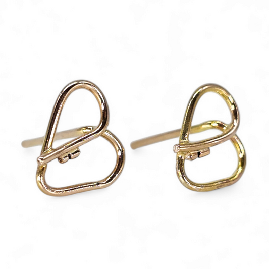 14K Gold heart shaped stud earrings that form a key in the center. 