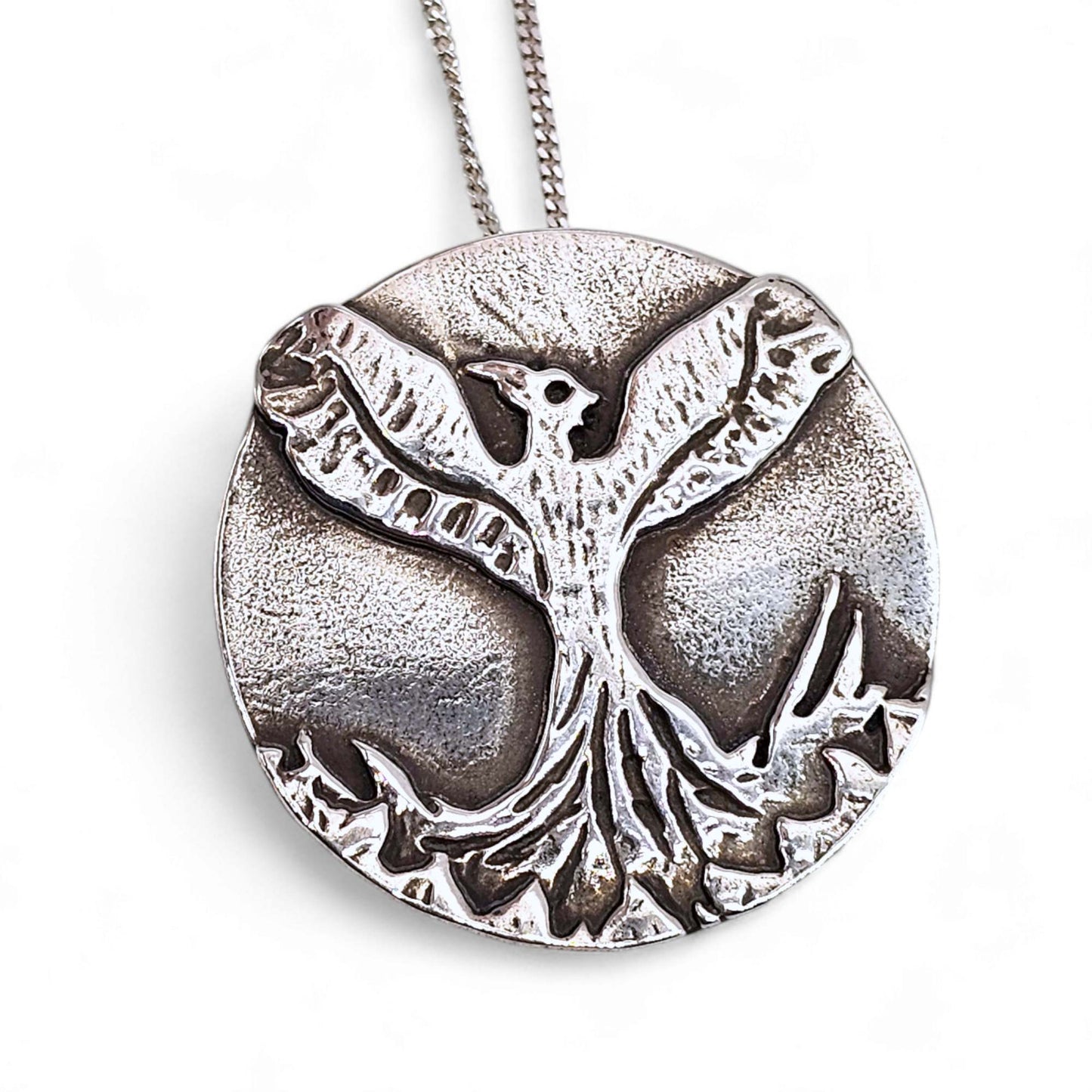 Sterling silver handcrafted Phoenix necklace as a symbol of resilience