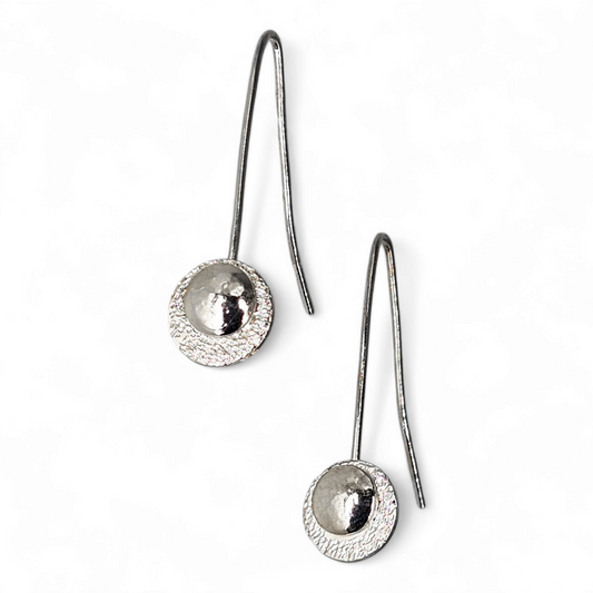 Silver Drop earrings featuring stars disc and domed and textured moon. 