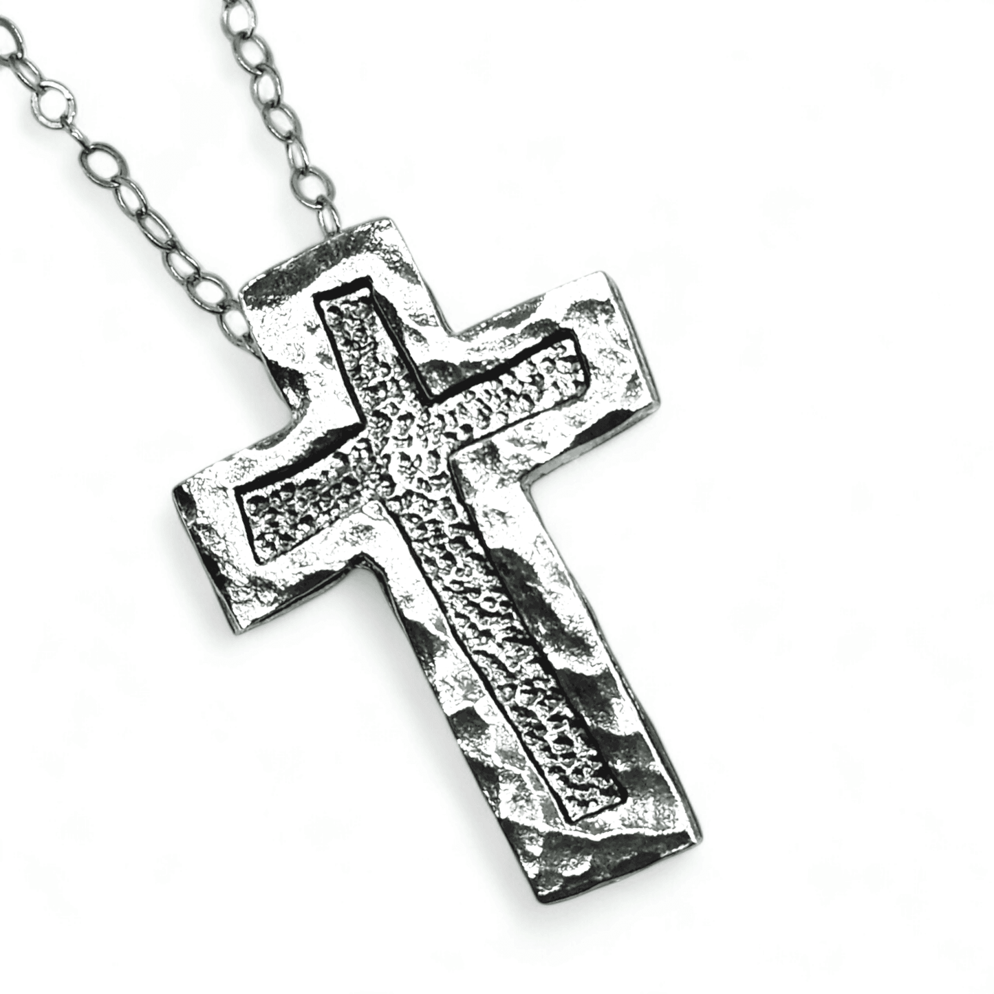 A sterling silver cross Christian necklaces on a white background.